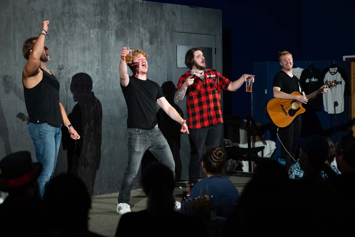 The Drunken Boyos singing with a live audience